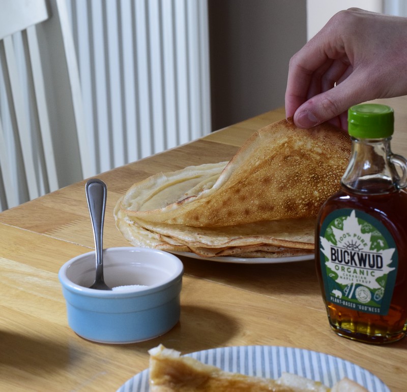 vegan crêpes recipe on wooden table