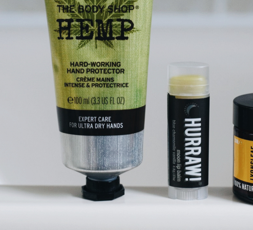 the body shop hemp hand cream for dry hands on bath edge